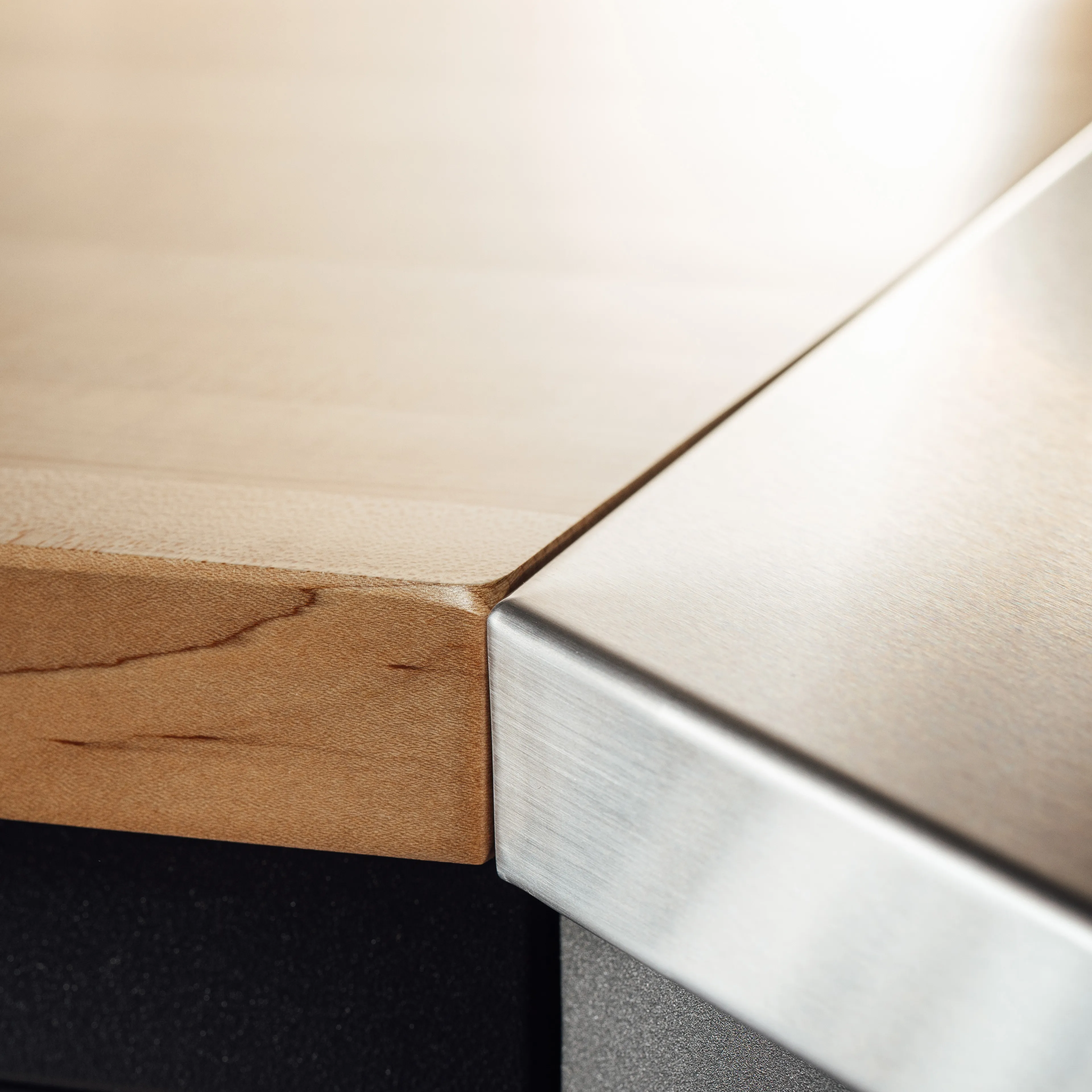 Countertops Image, showcasing a 1.5" thick solid maple butcher block countertop, and 16-gauge brushed stainless steel countertop with a birch, cabinet-grade plywood core.