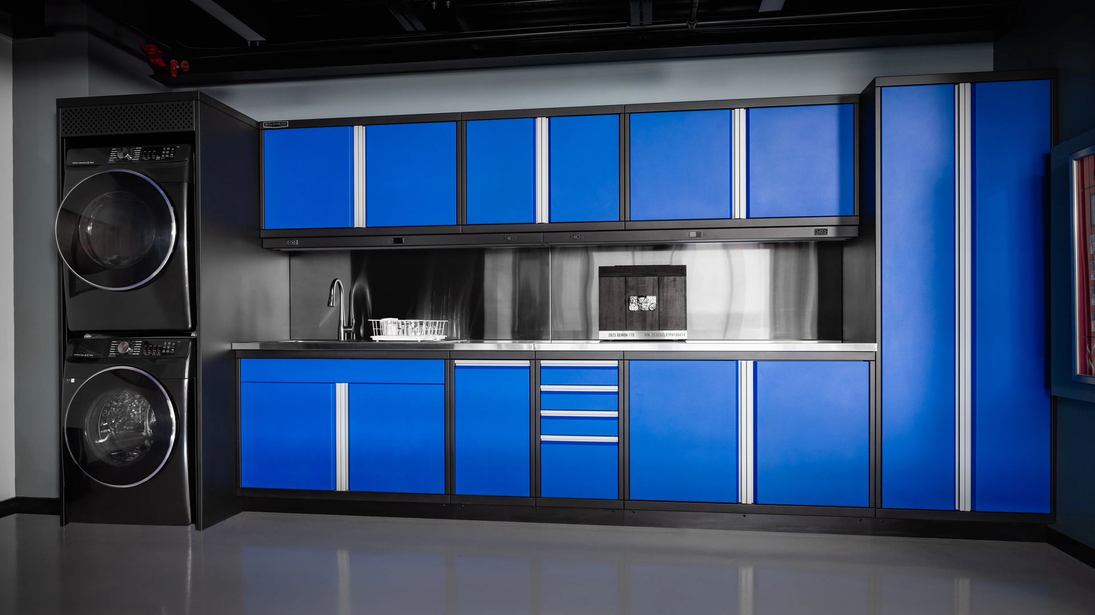Blue Baldhead cabinets installed in a garage along a wall.